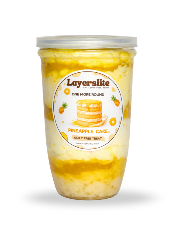 Layerslite Pineapple Cake dessert in a container with a clear lid on a black background